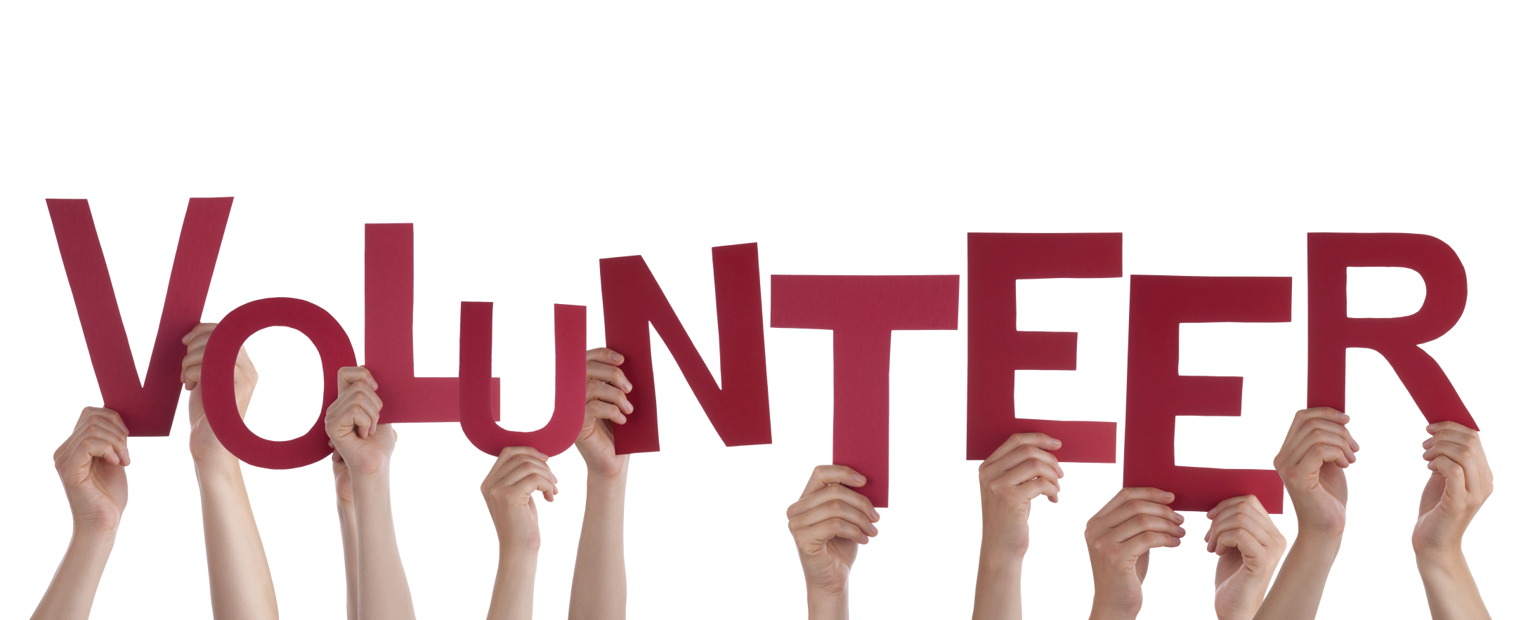 Hands holding up red letters that spell the word volunteer.